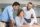 Team of managers satisfied with sales report. Young business expert and her male colleagues reading document. Expertise or consulting concept